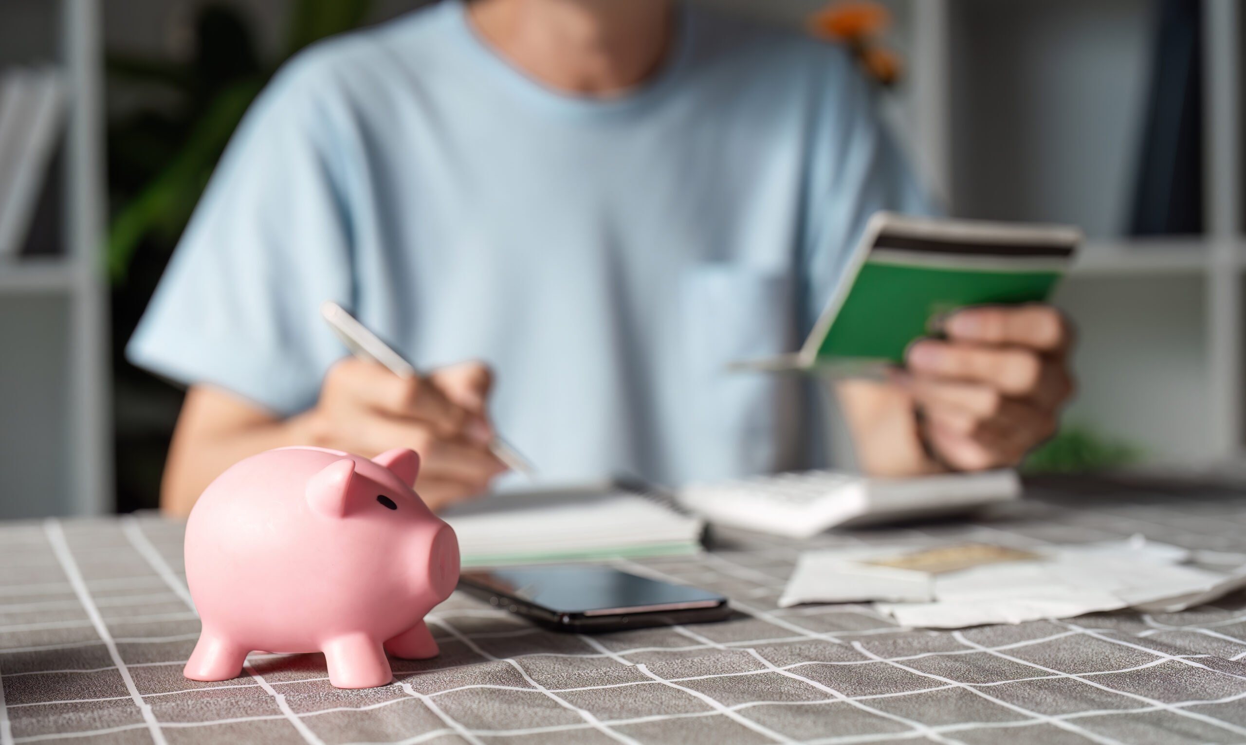 A man dedicated to managing his finances, holding budgeting